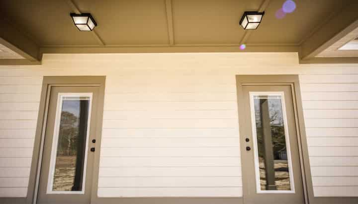 Hardie plank siding installation in a front entry way.